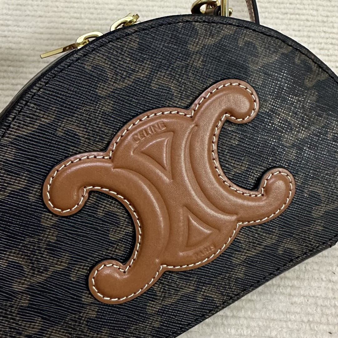 Ce**e half moon case in triomphe canvas and calfskin 17.5x12x6cm