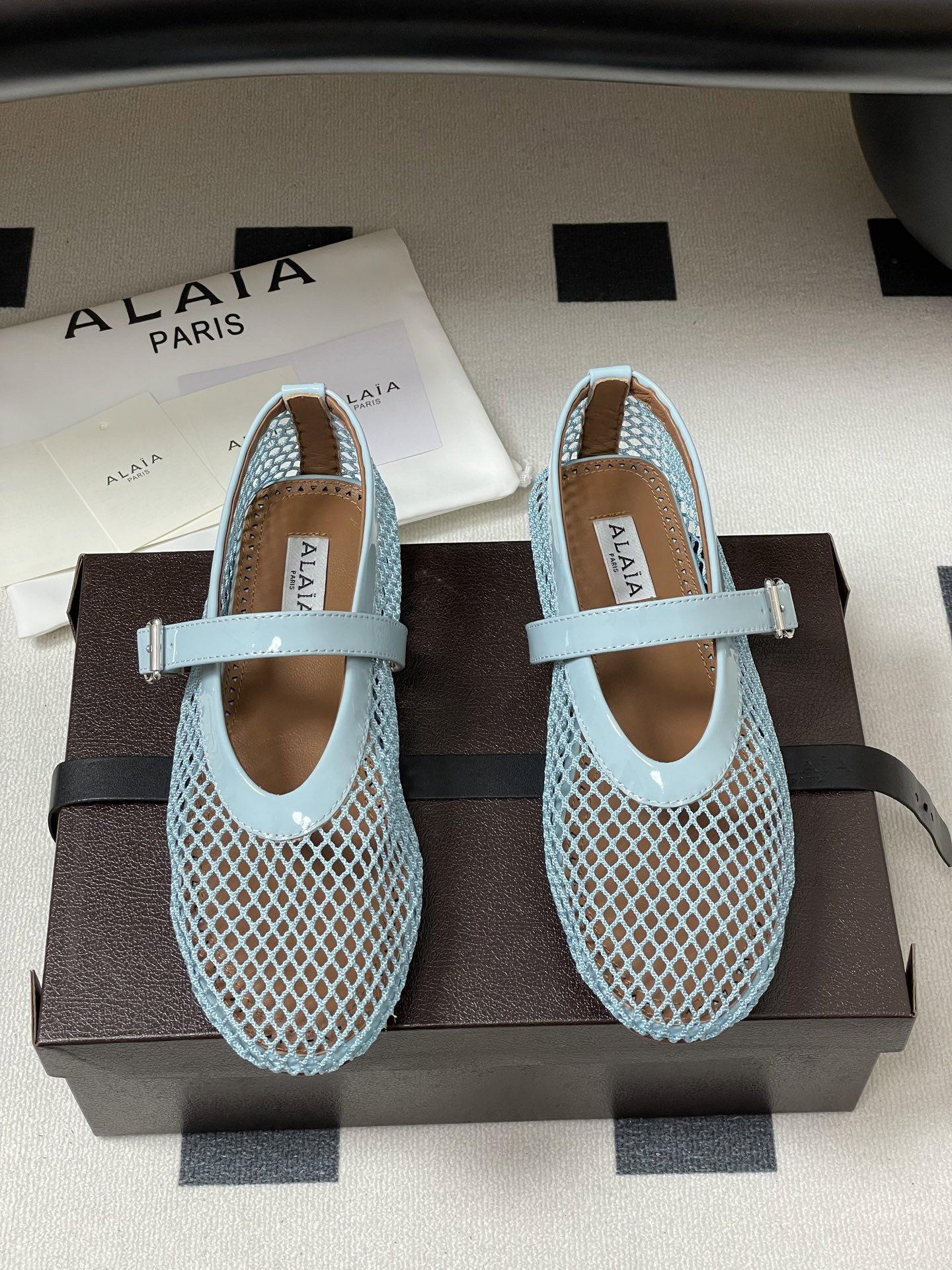 UA ALAÏA BALLET FLATS IN FISHNET